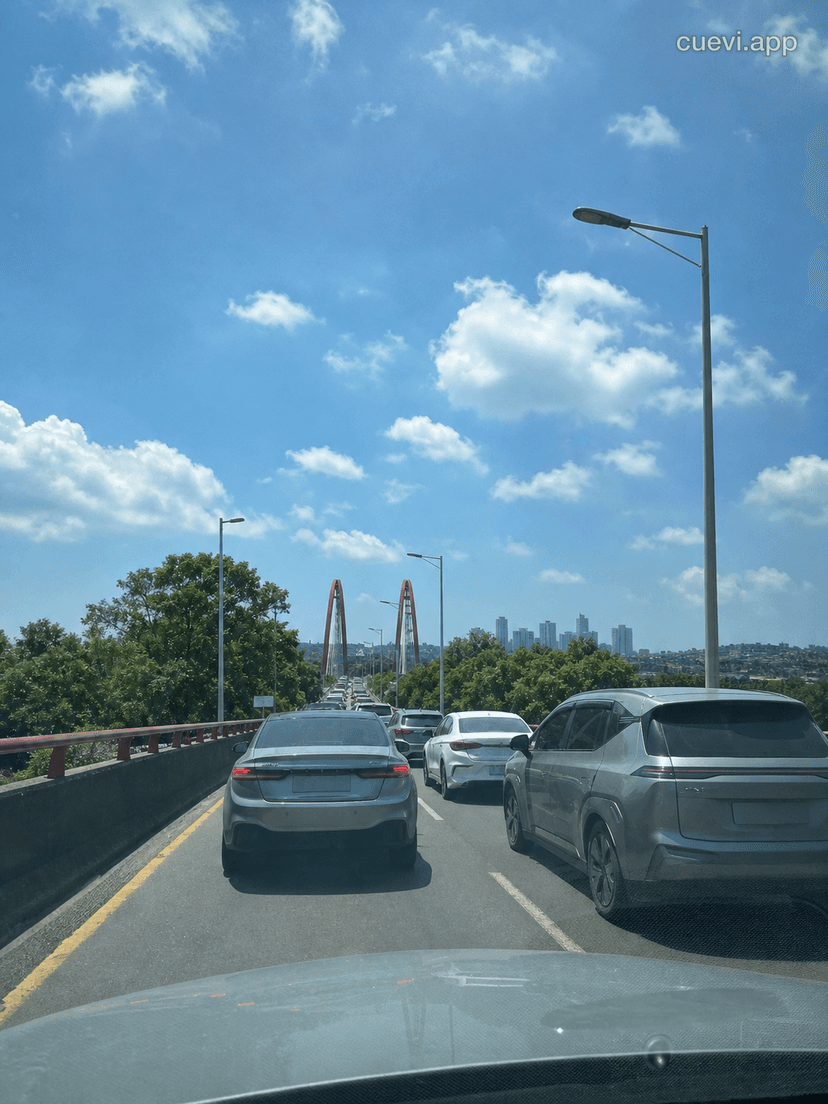 Traffic Jam, Expand the Image, Looks Like the Bridge in the Distance Is Already Getting Congested
